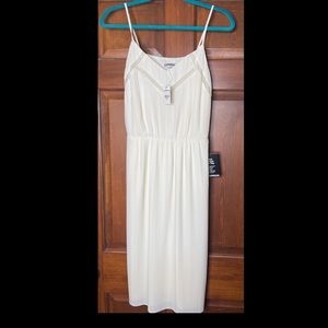 Women’s cream colored knee length midi pleated dress